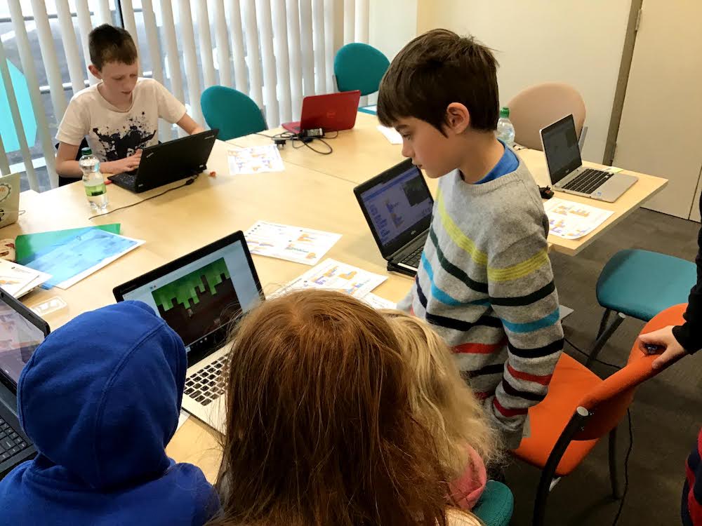 Children coding in Scratch