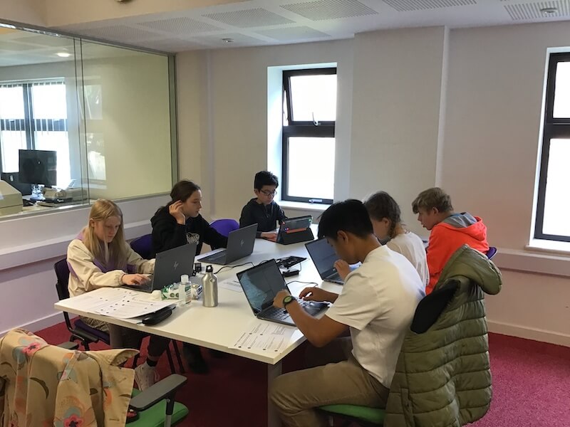 Students learning to code in Python